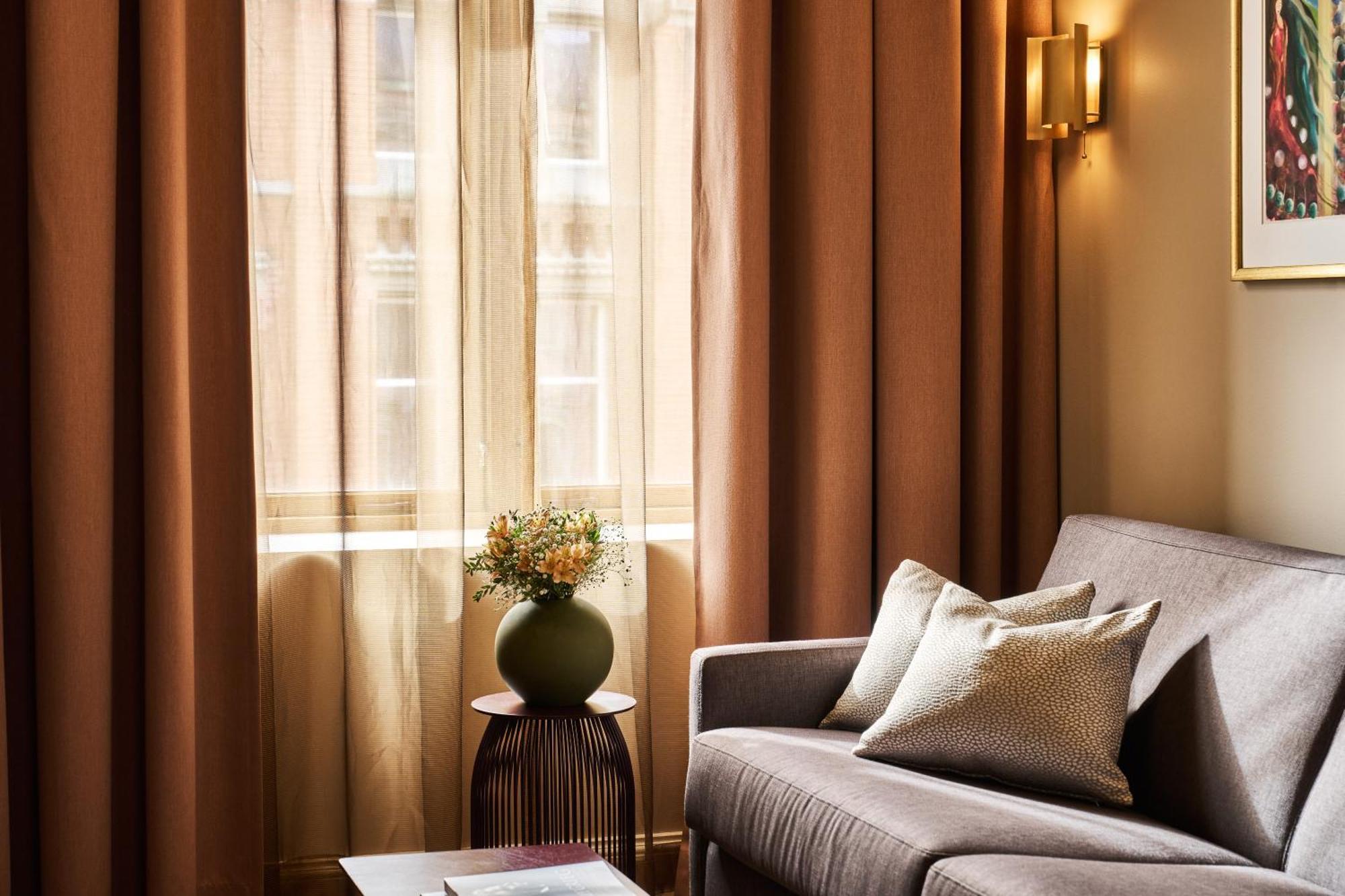 Opus 16 Hotel Bergen Exterior photo Curtains in a living room